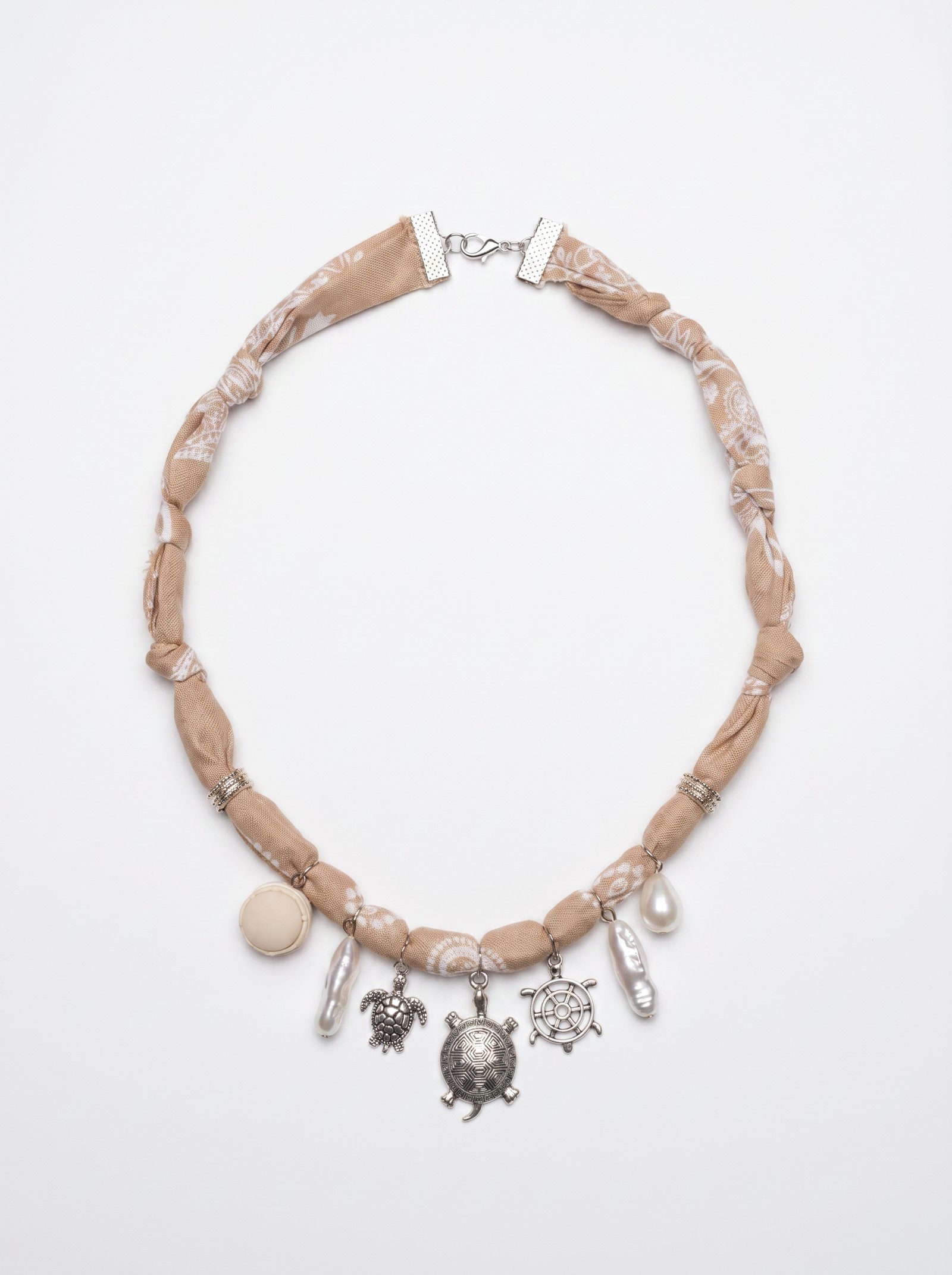 https://veline.ae/storage/photos/1/Charm Necklaces/Nude_Pearl_Charms.JPG